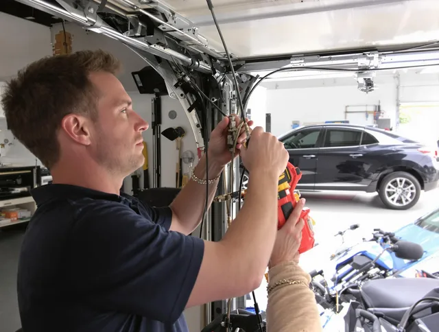 Rosemead Garage Door Repair safety certified technician performing cable replacement in Rosemead